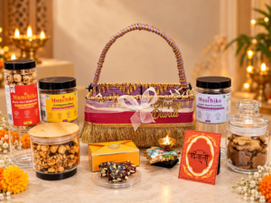 Munchika Shagun Anand Diwali Gift Hamper in Jute Basket with Chatpata Bhel, Jowar Cookies, Peri Peri Makhana, Date Bites & Decorative Diya